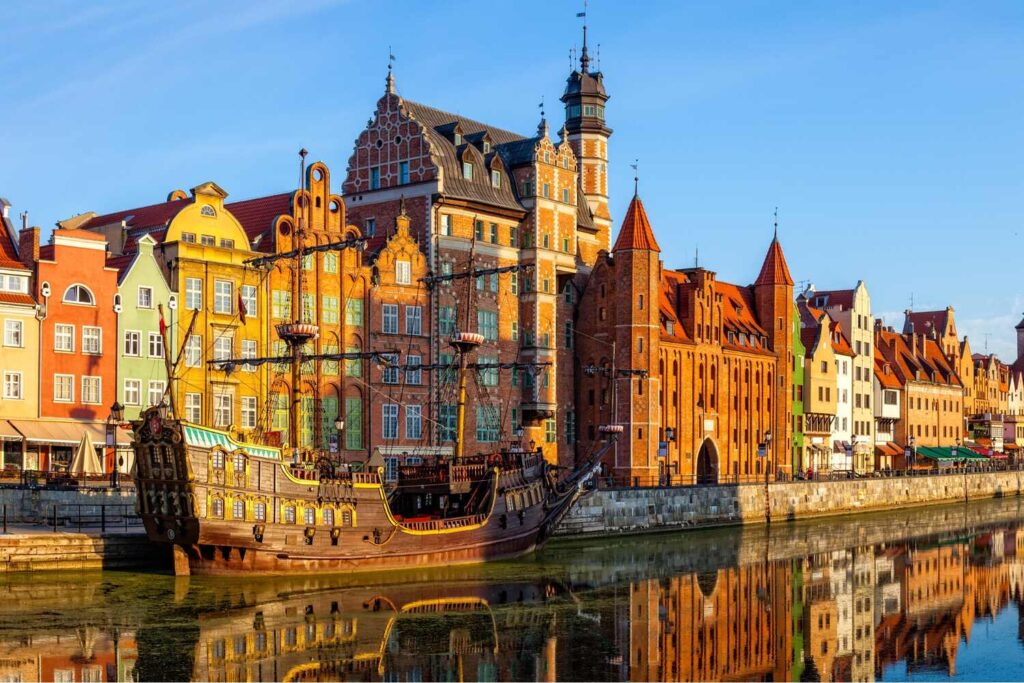 Colorful waterfront buildings and ship in Gdansk - Best things to do in Poland